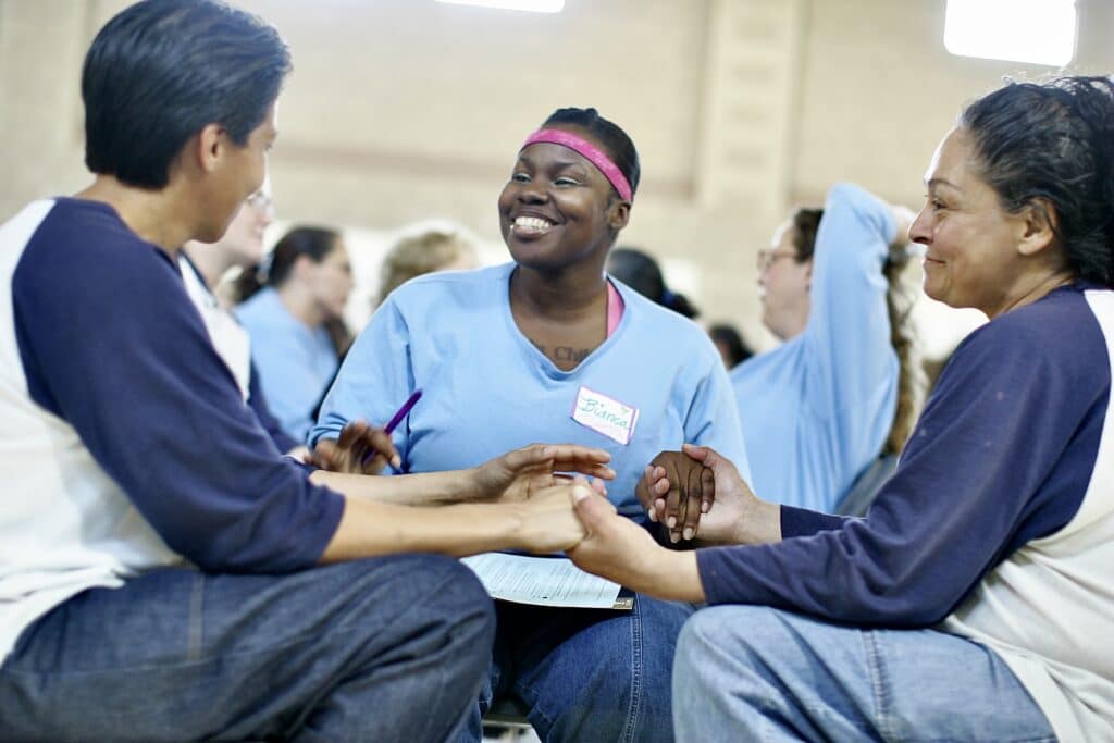 Three incarcerated women work in a Trio at Valley State Prison for Women. (photo by David Sand)